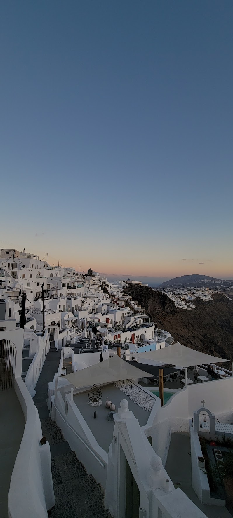 Steep Santorini steps leading to hotel entrance