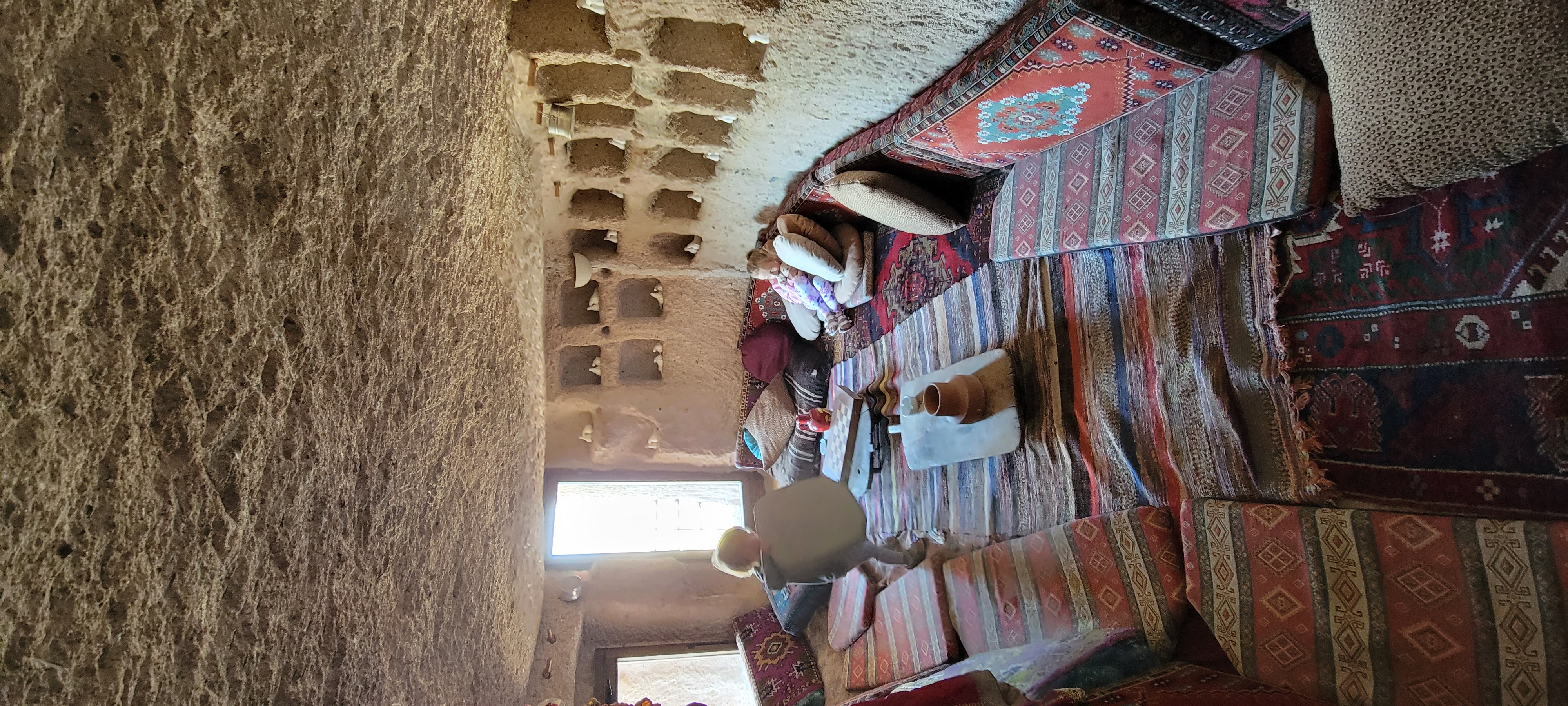 Cappadocia cave hotel with hot air balloons